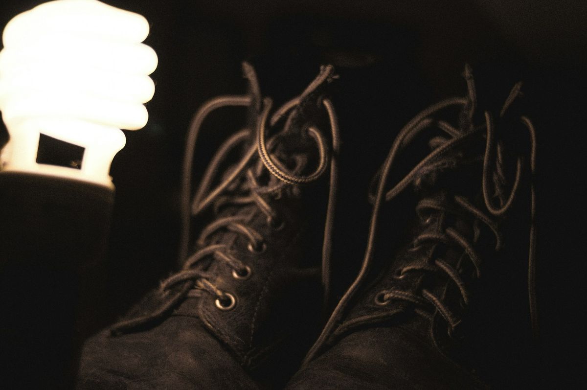Pair of black leather duty boots with laces