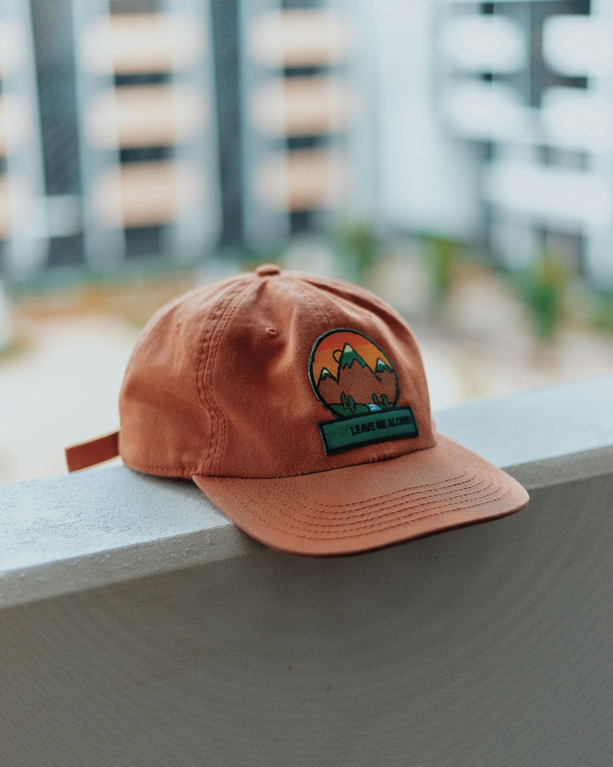 Embroidered patch stitched onto a cap