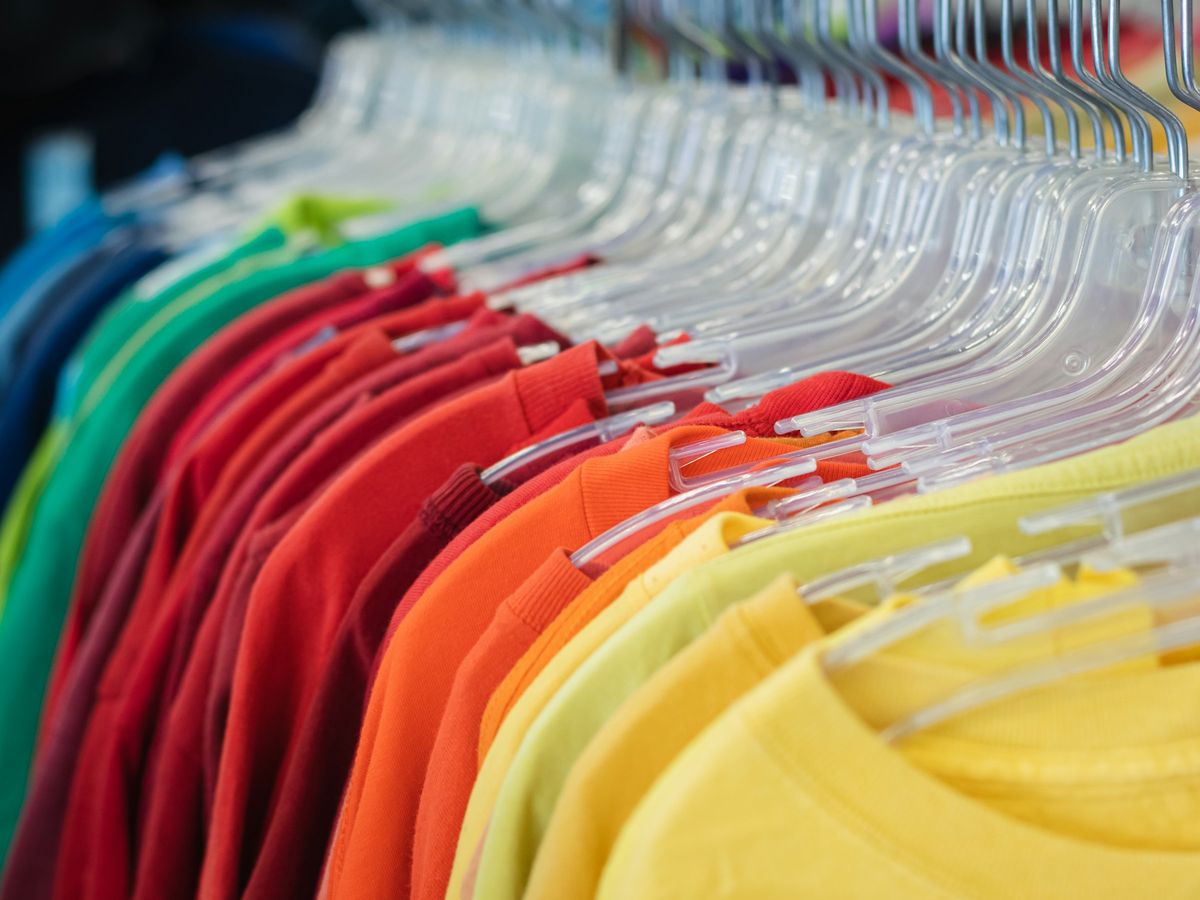 Shirts in a range of colours on a rack