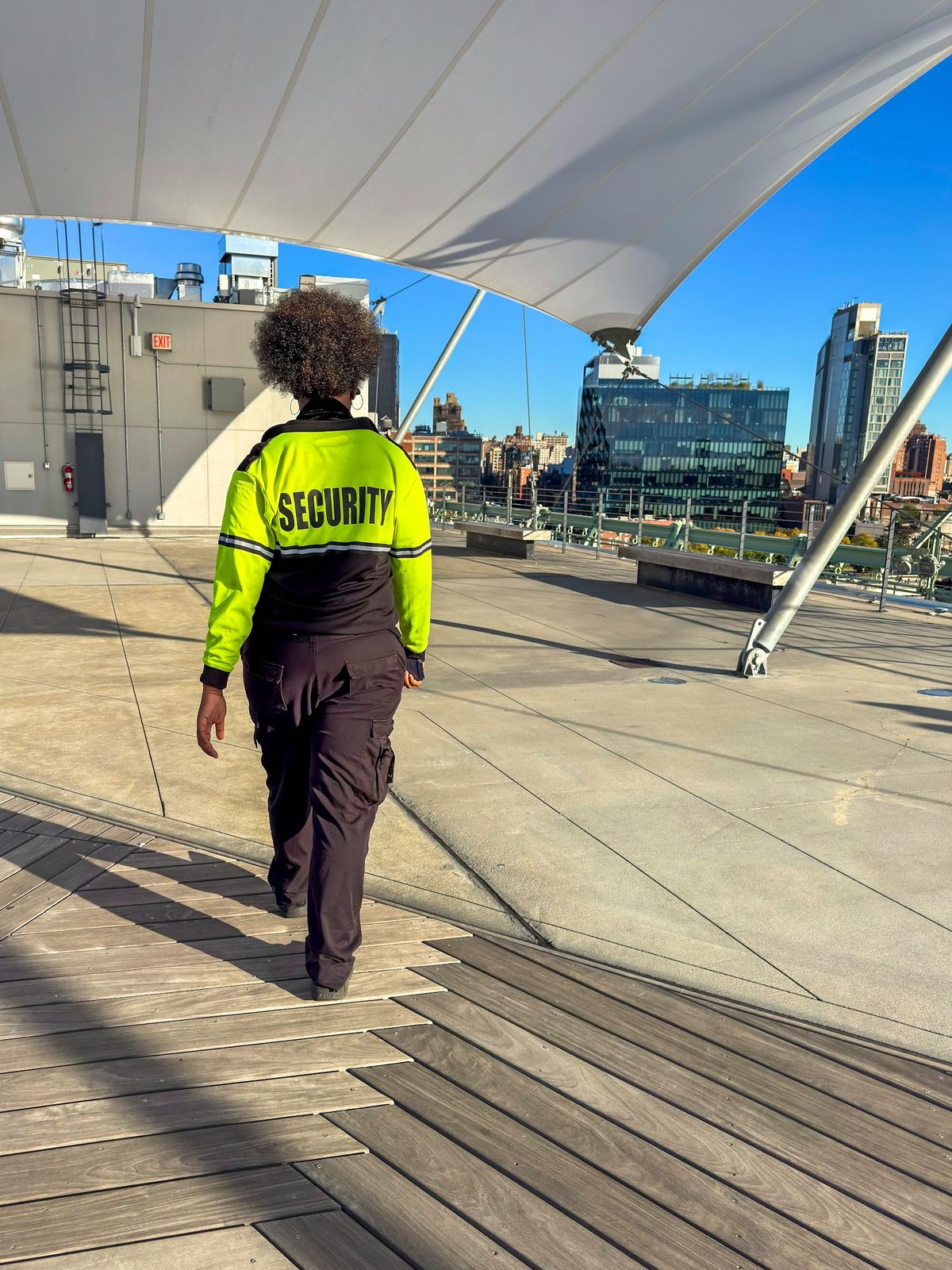 Security officer in high-visibility jacket on patrol