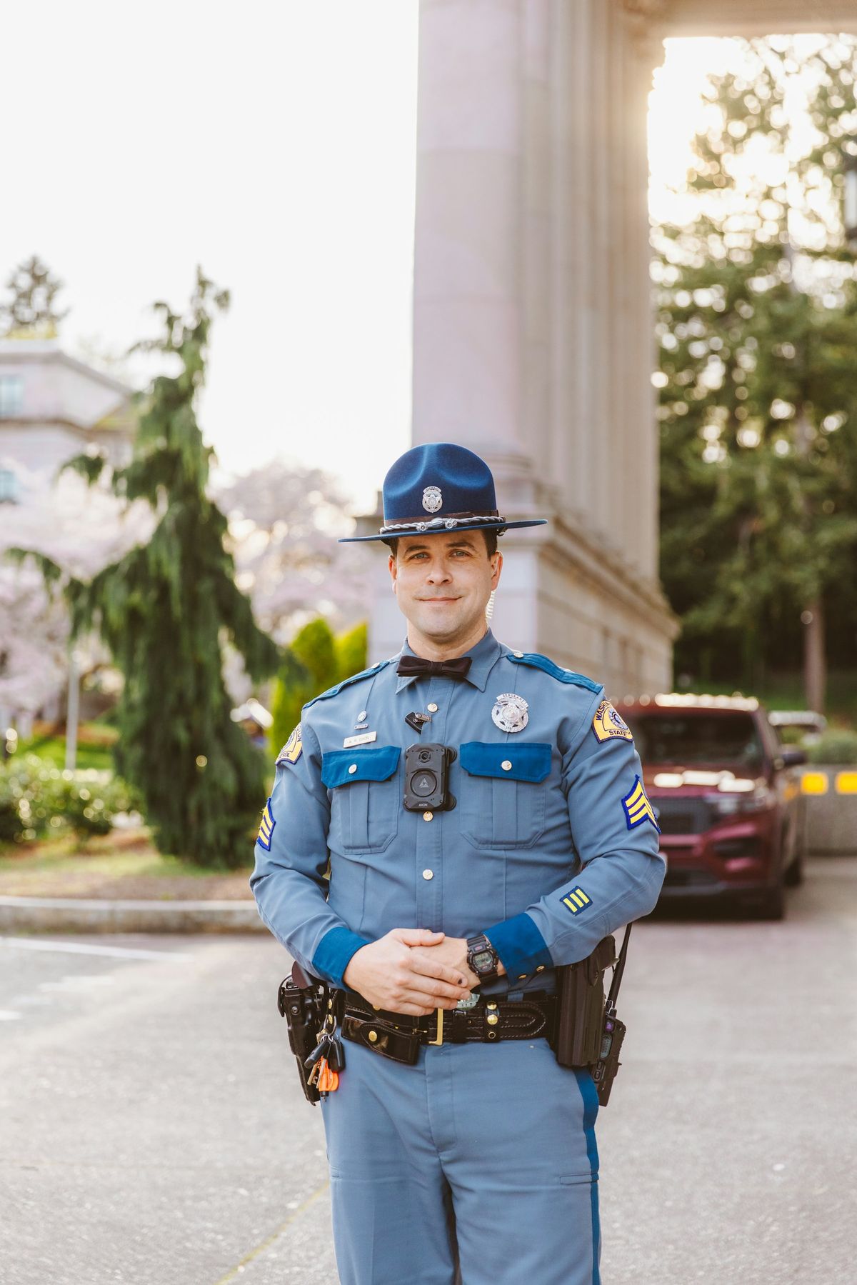 Officer in a pressed Class A uniform with campaign hat