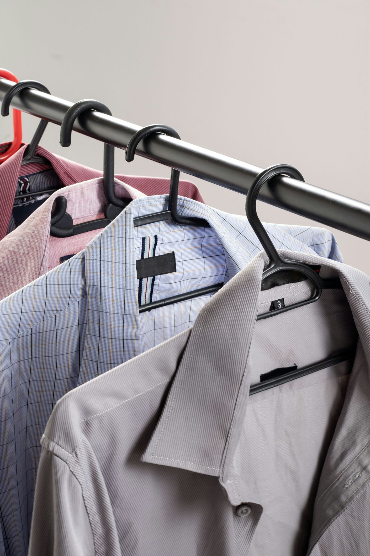Row of uniform shirts on hangers ready for a group order